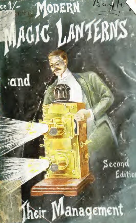 A person with a mustache holding a camera
Description automatically generated