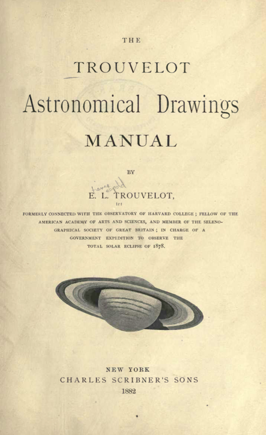 A book with a picture of a planet
Description automatically generated