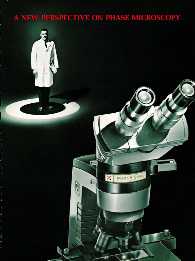 A person standing in a lab coat
Description automatically generated