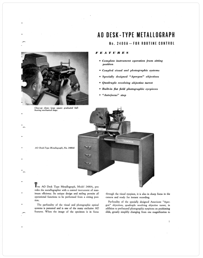 A black and white photo of a person using a metallograph
Description automatically generated