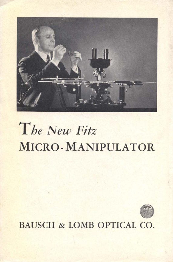 A person using a microscope
Description automatically generated