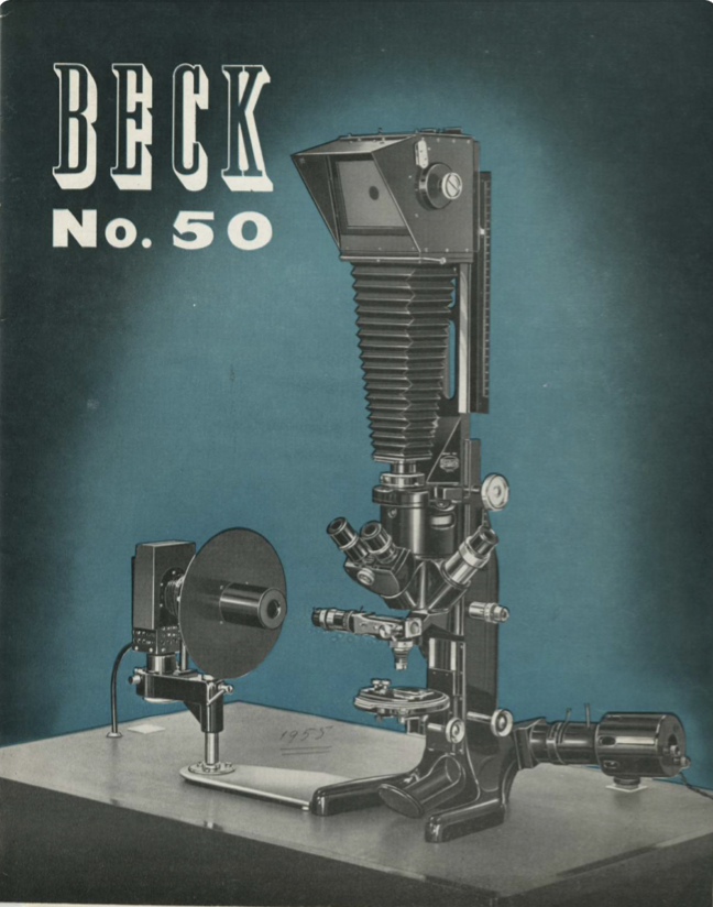 A black and white photo camera
Description automatically generated