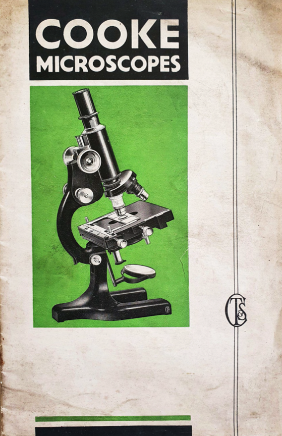 A black and white microscope
Description automatically generated