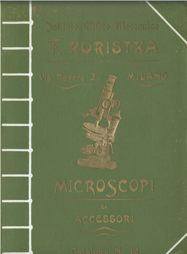 A green book with a picture of a microscope
Description automatically generated