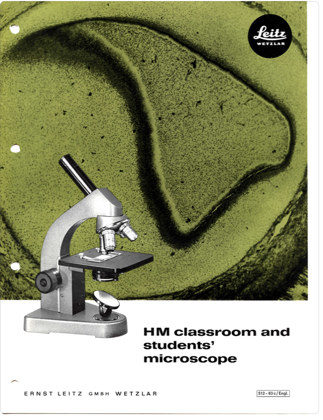 A microscope on a cover
Description automatically generated