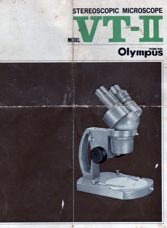 A close-up of a microscope
Description automatically generated