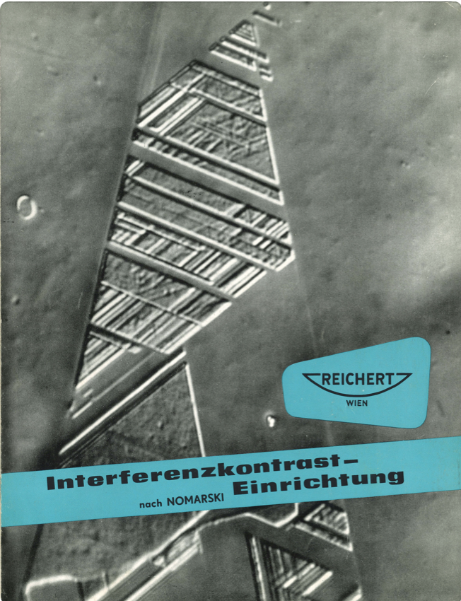 A black and white photo of a triangle shaped window
Description automatically generated