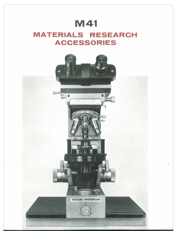 A close-up of a microscope
Description automatically generated