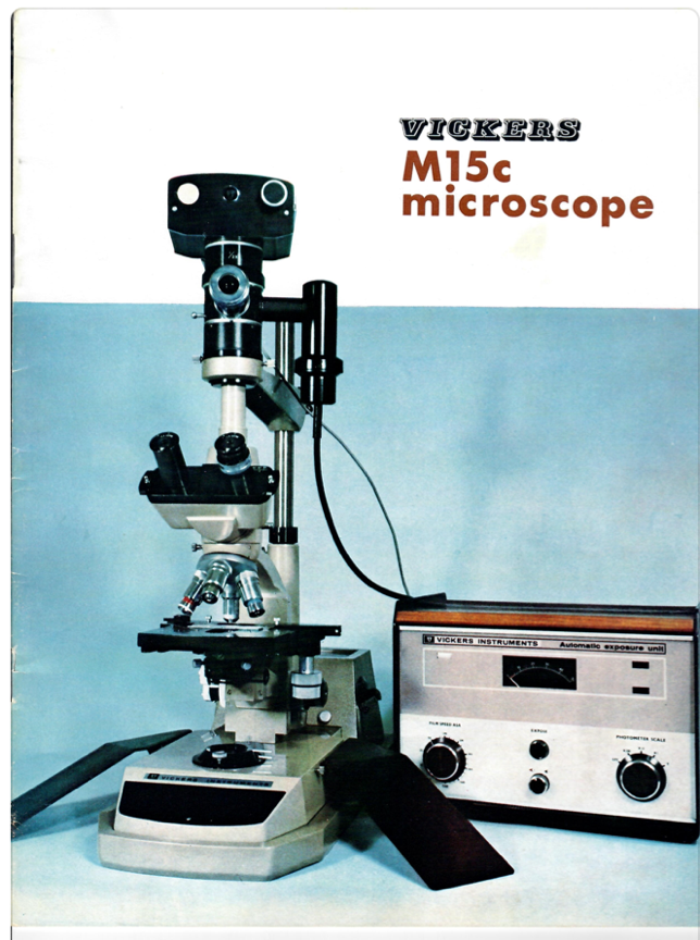 A microscope and radio on a table
Description automatically generated