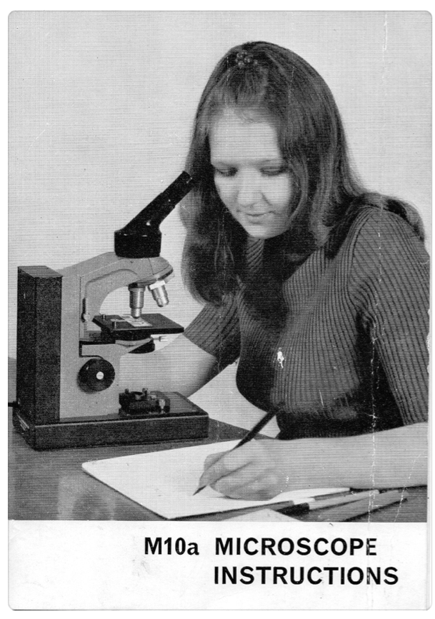 A person writing on a piece of paper
Description automatically generated