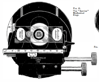 A picture containing text, black, camera
Description automatically generated
