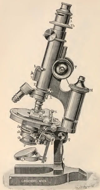 A picture containing object, microscope, indoor, table
Description automatically generated