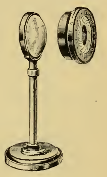 A picture containing clock, sitting, table, standing
Description automatically generated