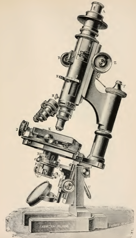 A picture containing microscope, object, photo, old
Description automatically generated
