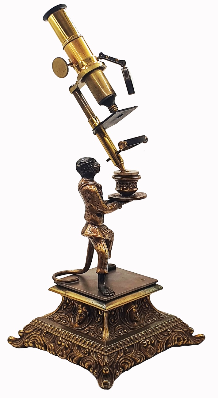 Microscope Statue A statue of a person holding a microscopeDescription automatically ...