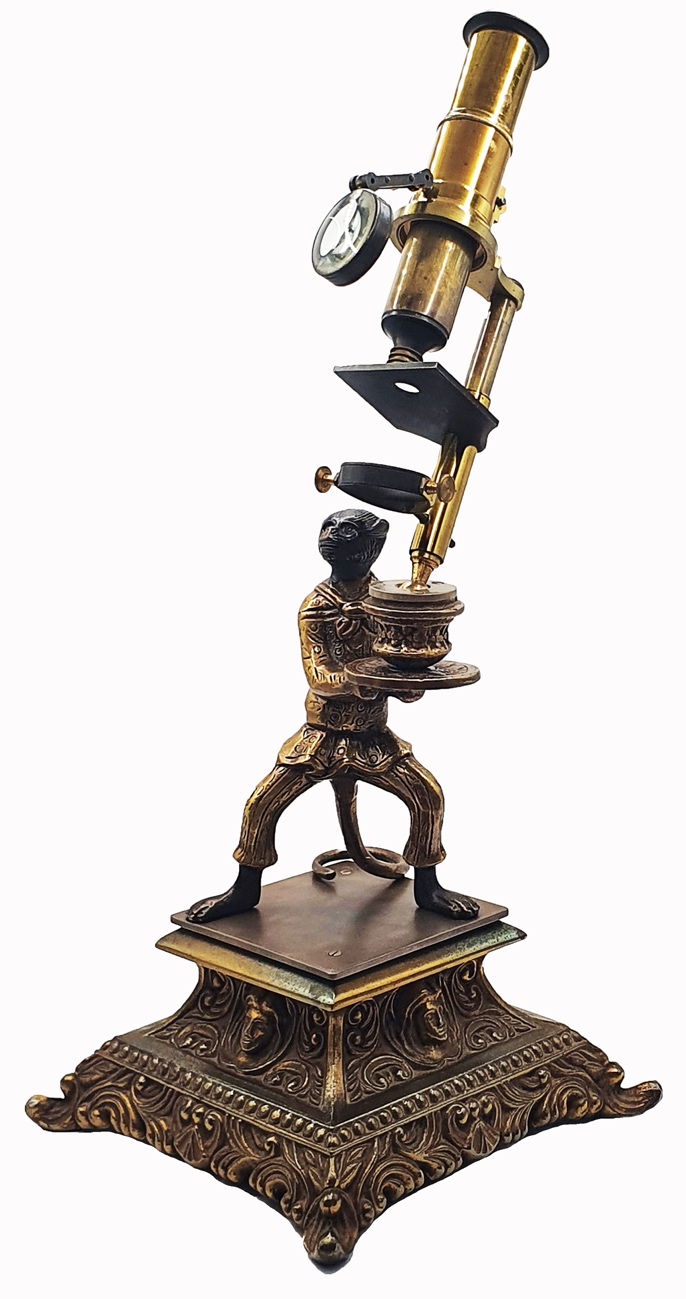 Microscope Statue A statue of a monkey holding a microscopeDescription automatically ...