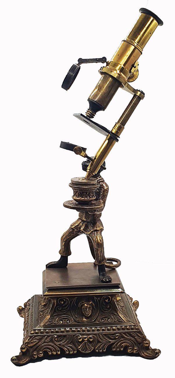 Microscope Statue A statue of a person holding a microscopeDescription automatically ...