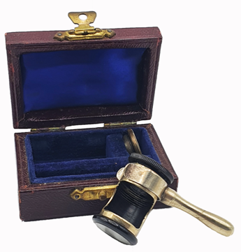 A small box with a hammer and a small object
Description automatically generated with medium confidence