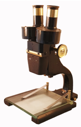 A close-up of a microscope
Description automatically generated