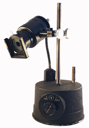 A black object with a round base
Description automatically generated