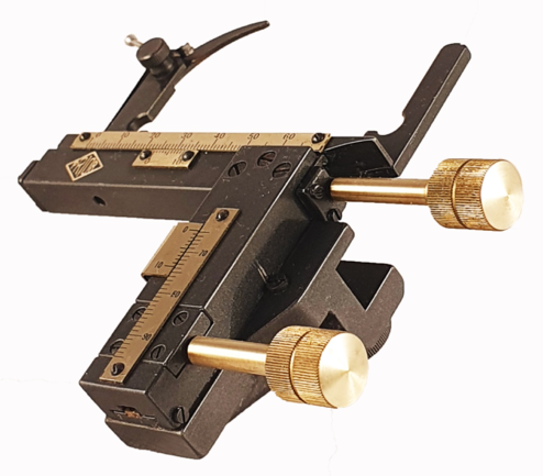 A black and gold scale
Description automatically generated