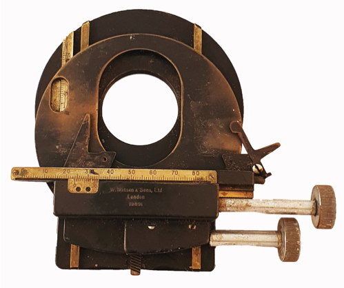 A metal circular object with a measuring tape
Description automatically generated